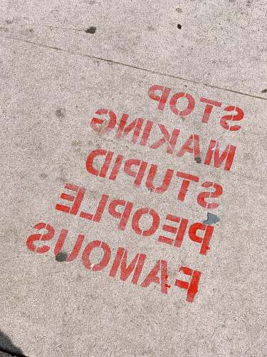 los angeles stop making stupid people famous signage quote